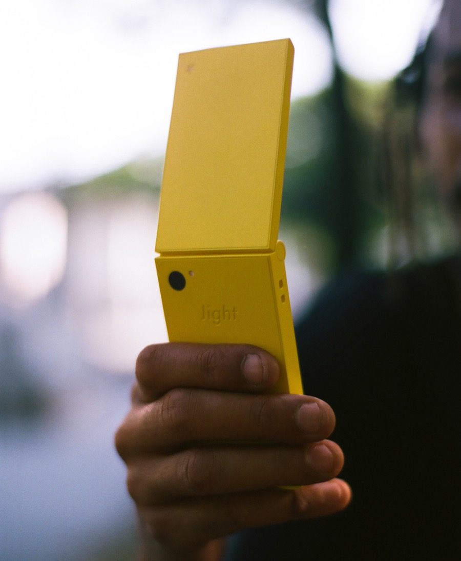 Yellow Light Flip held in hand, in one of the photos that Marques Brownlee published in X about the minimalist phone