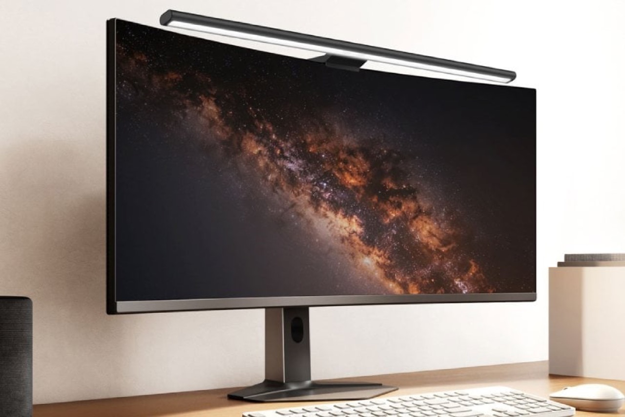 Mijia Monitor Light Bar 2 mounted on a curved monitor with adjustable clamp and asymmetric light on the desk